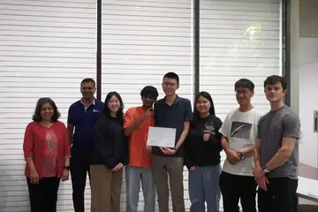 The smart glasses bootcamp team lined up with our certificate at NUS.